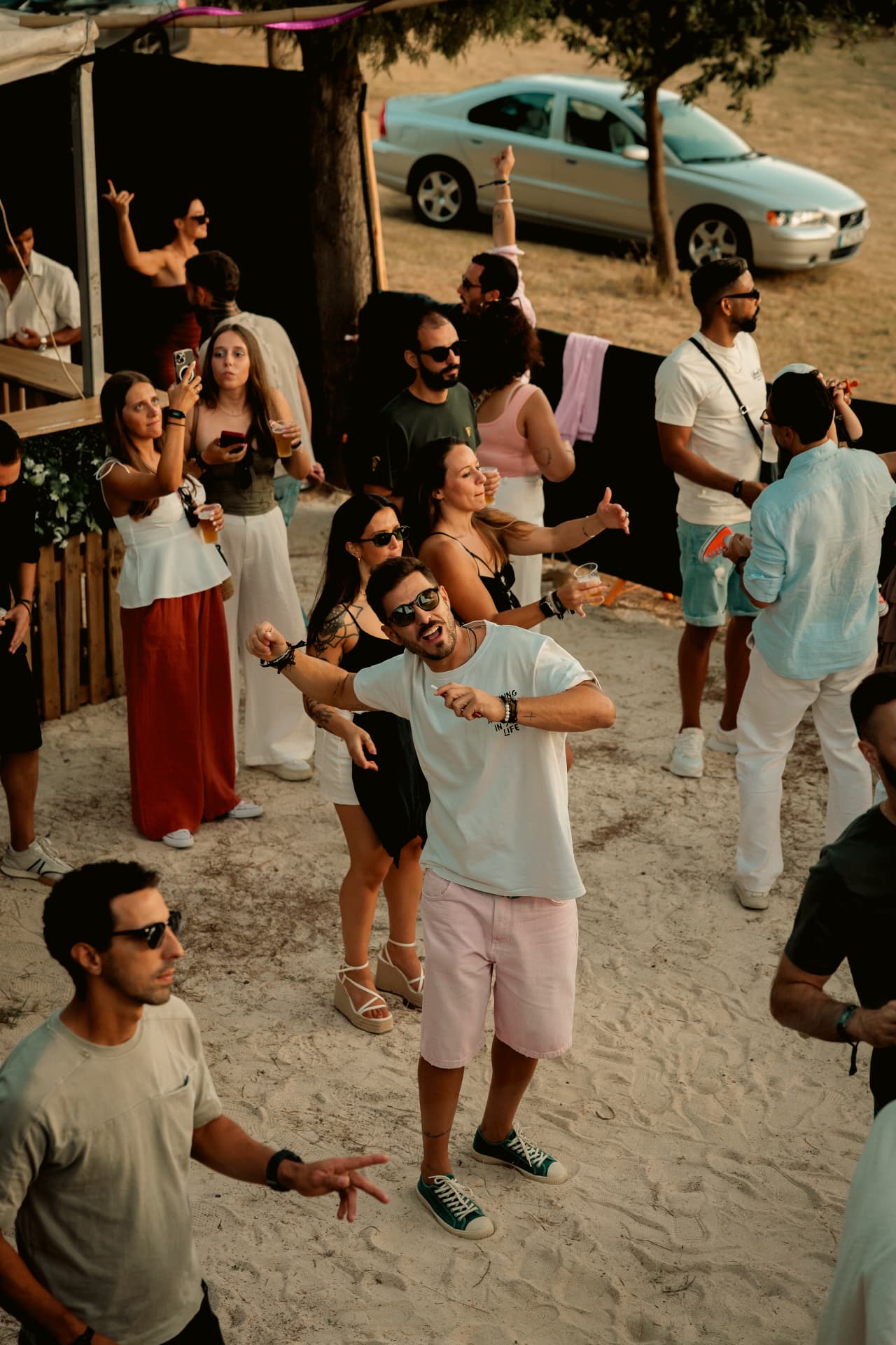 Guests dancing on the sand