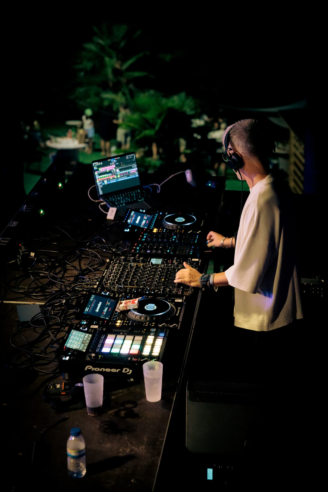 DJ at the decks in the dark