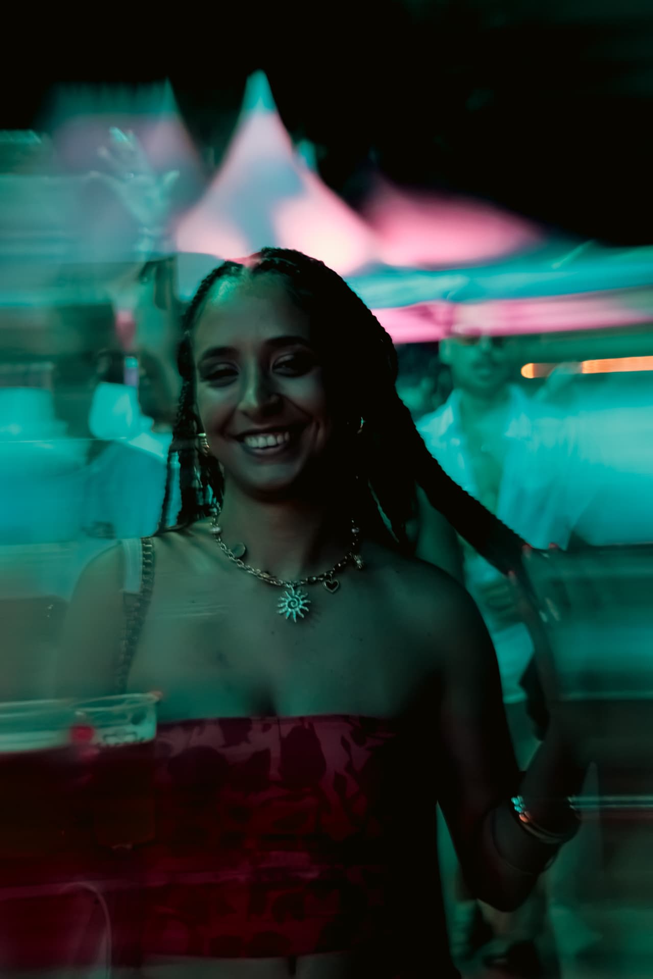 Smiling dancer in teal motion blur